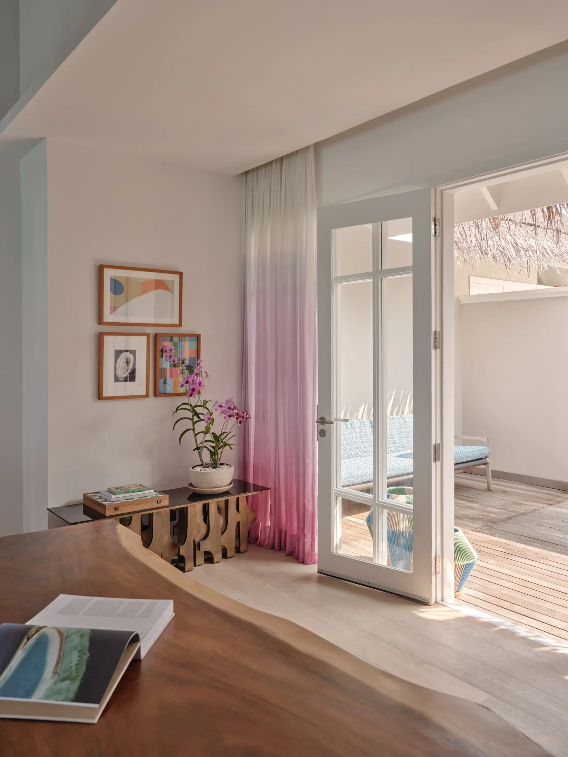 seaside finolhu maldives rockstar two bedroom dining and entrance area stylish open dining and entry space with warm textures and refined island design