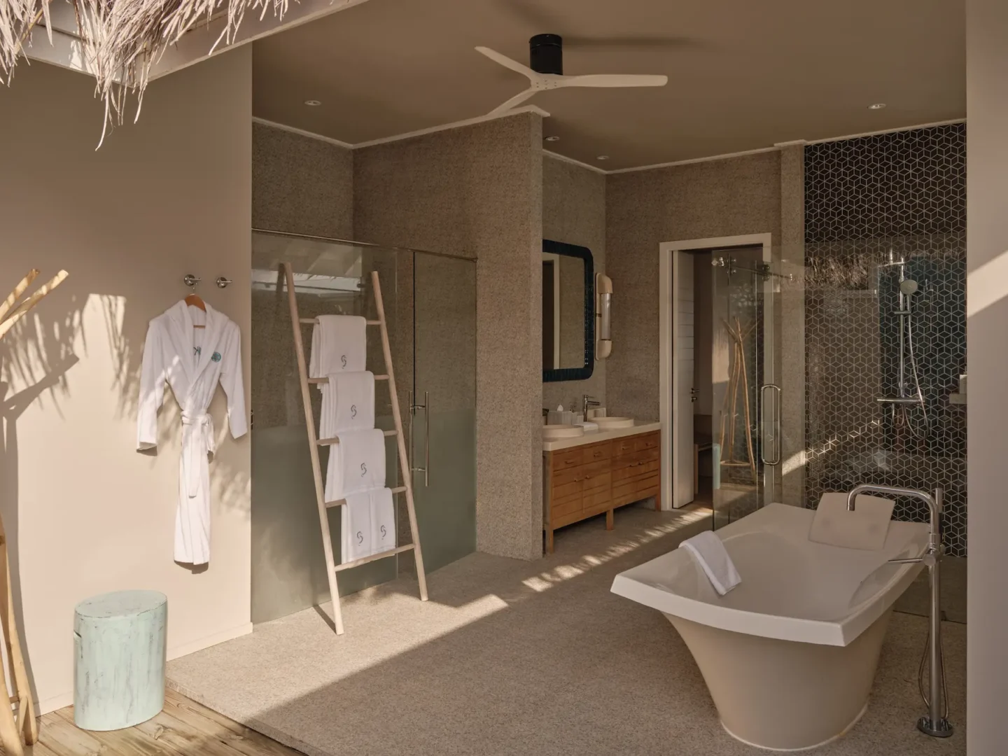 seaside finolhu maldives rockstar two bedroom villa bathroom elegant spa inspired bathroom with natural textures and soft ambient light