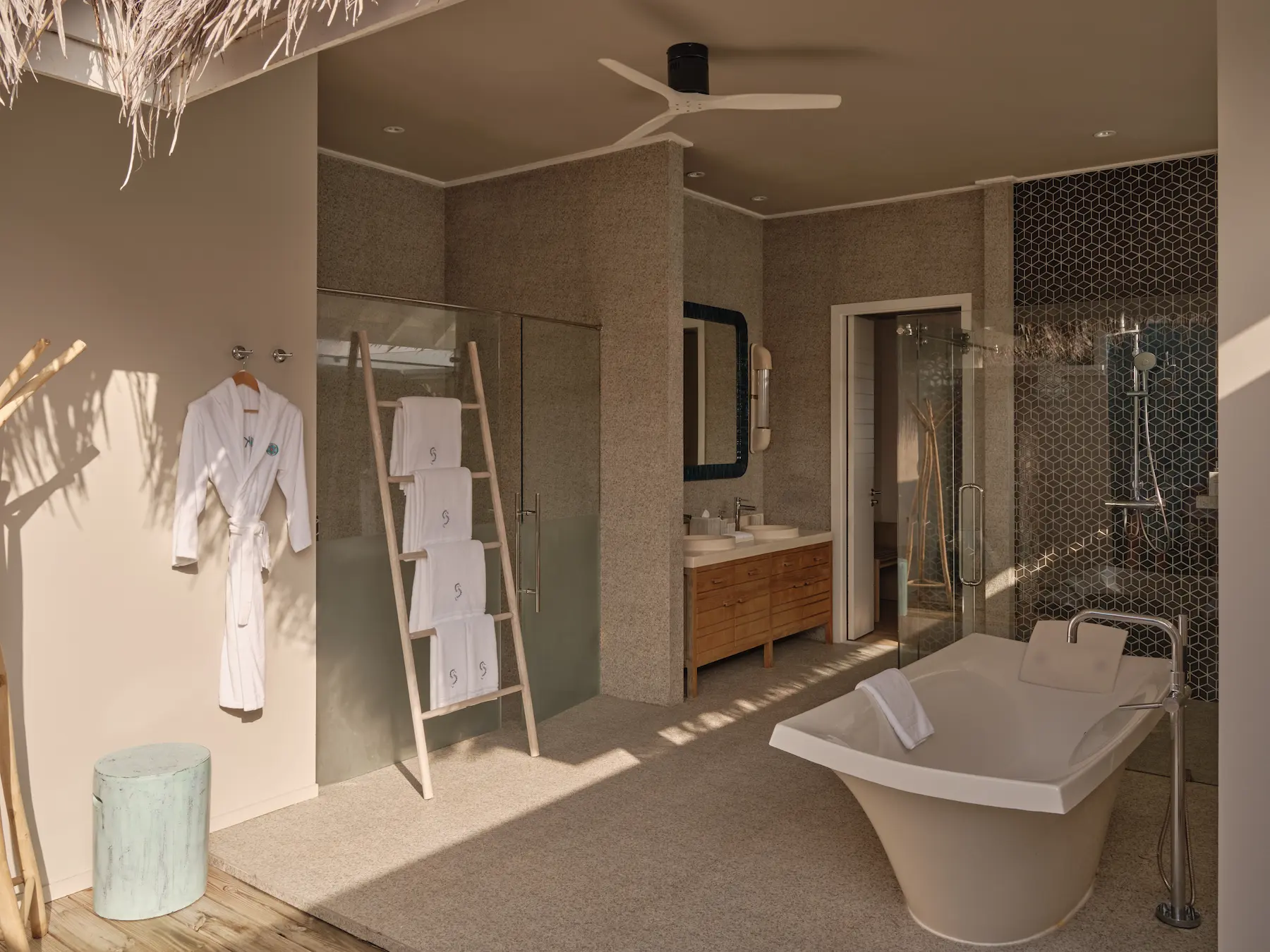 seaside finolhu maldives rockstar two bedroom villa bathroom elegant spa inspired bathroom with natural textures and soft ambient light
