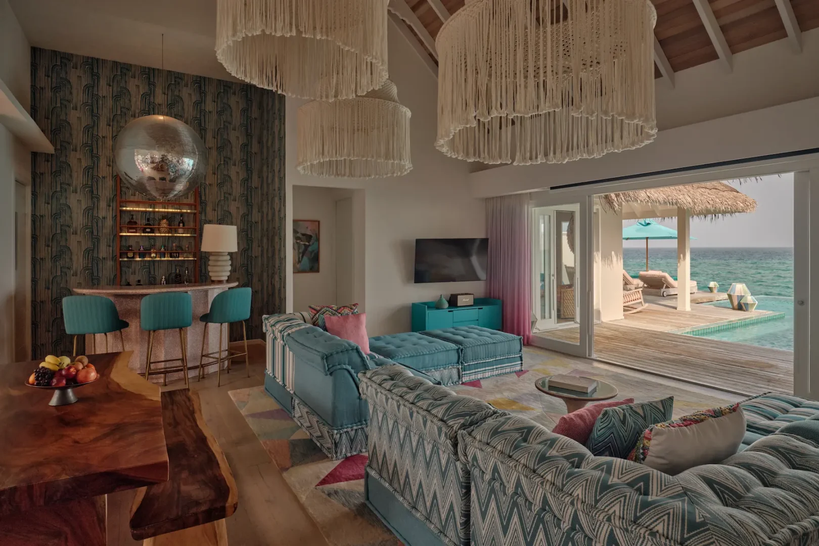 seaside finolhu maldives rockstar two bedroom villa living and dining area refined open plan living and dining space with warm island textures and gentle natural light