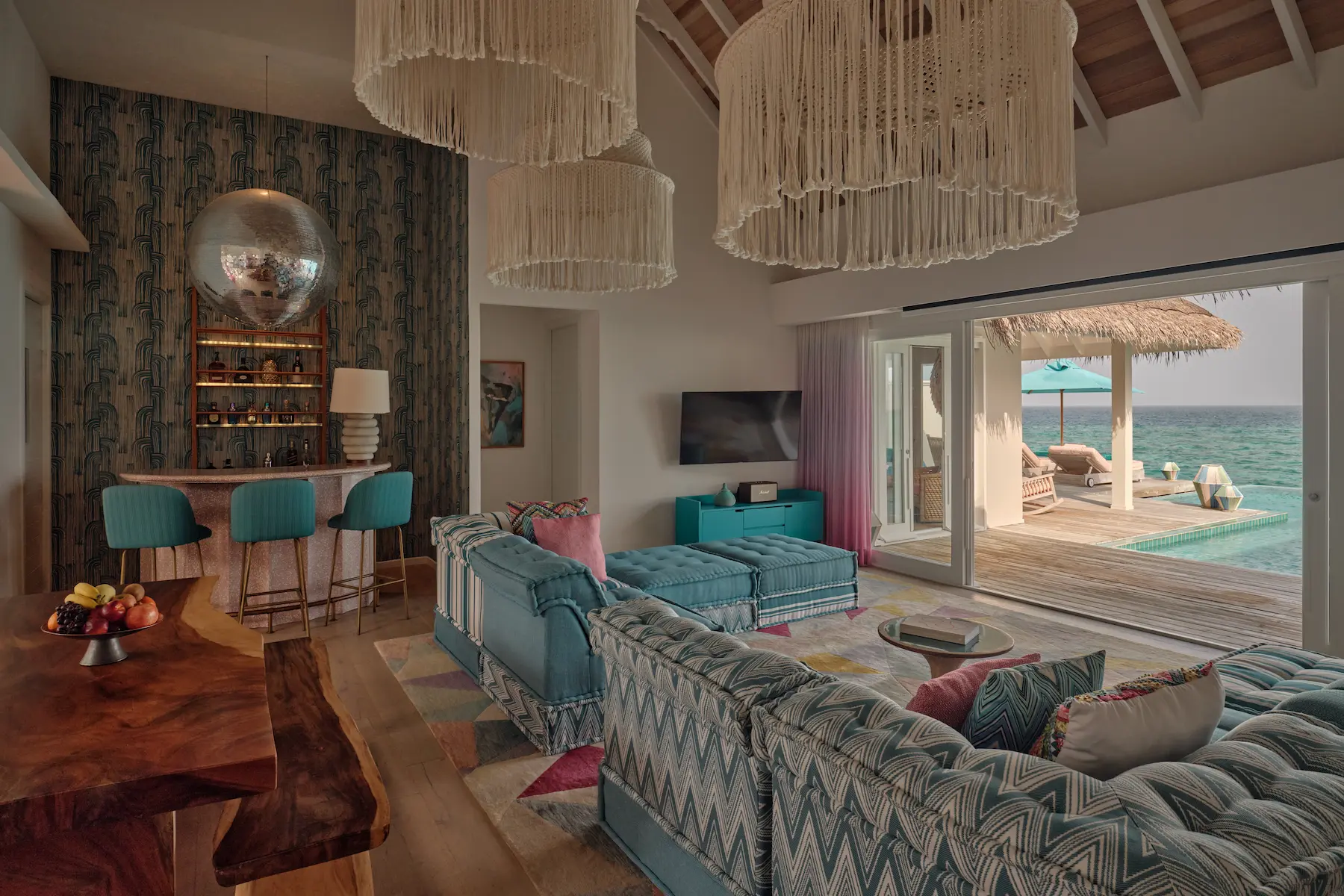 seaside finolhu maldives rockstar two bedroom villa living and dining area refined open plan living and dining space with warm island textures and gentle natural light