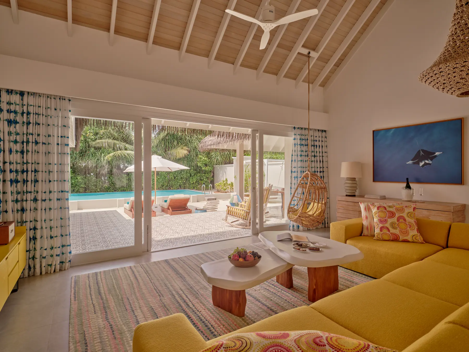 seaside finolhu maldives two bedroom beach pool villa living area sophisticated open plan lounge with soft coastal tones and breezy garden views