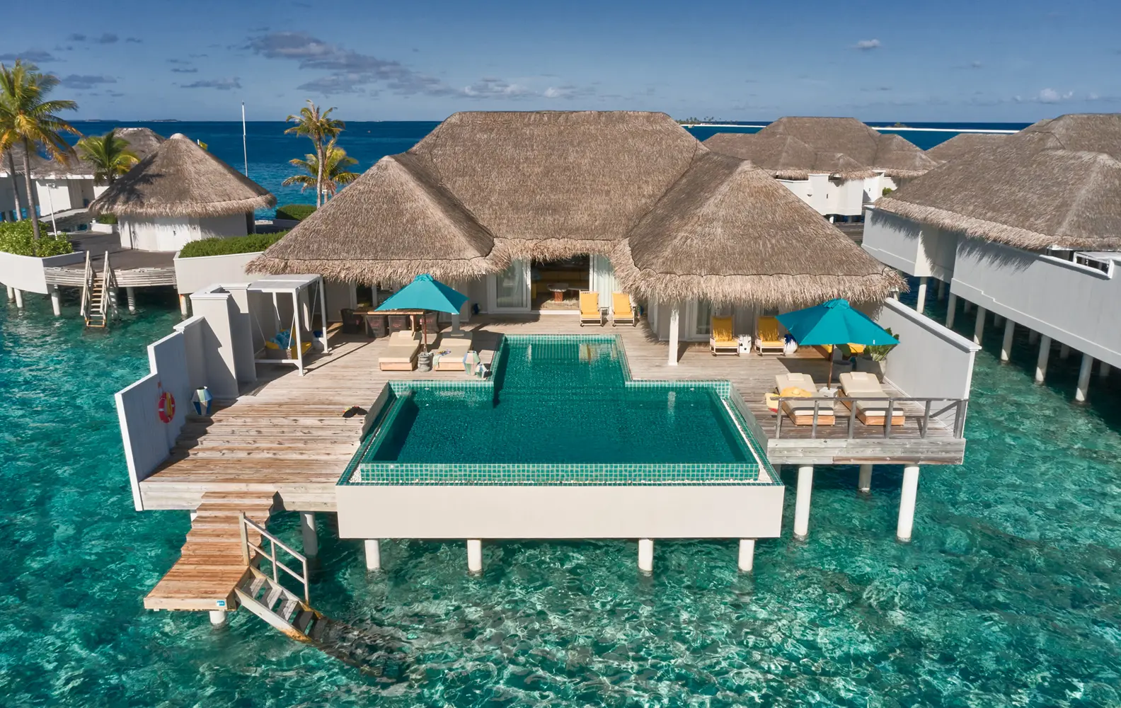 seaside finolhu maldives two bedroom water villa with pool elegant exterior view set above the turquoise lagoon