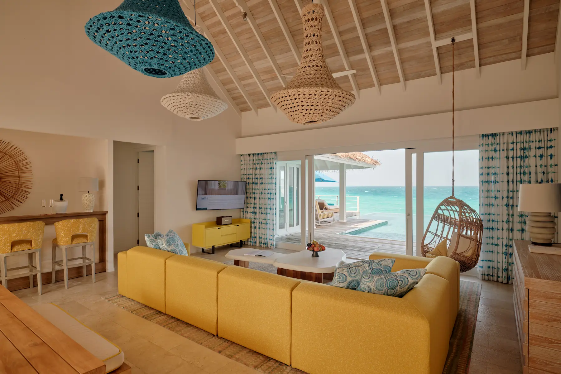 seaside finolhu maldives two bedroom water villa with pool serene living space opening to an expansive pool deck over the lagoon