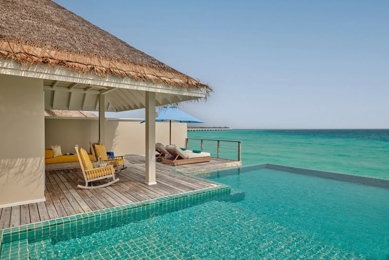seaside finolhu maldives two bedroom water villa with pool elegant pool deck area overlooking clear lagoon waters