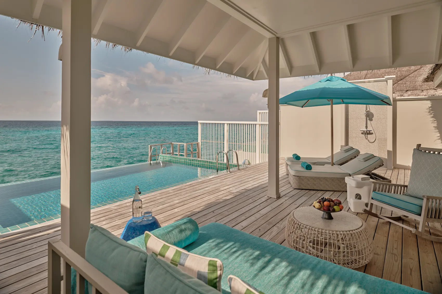 seaside finolhu ocean pool villa terrace and pool area featuring private overwater lounging space turquoise ocean views and serene maldives island ambience
