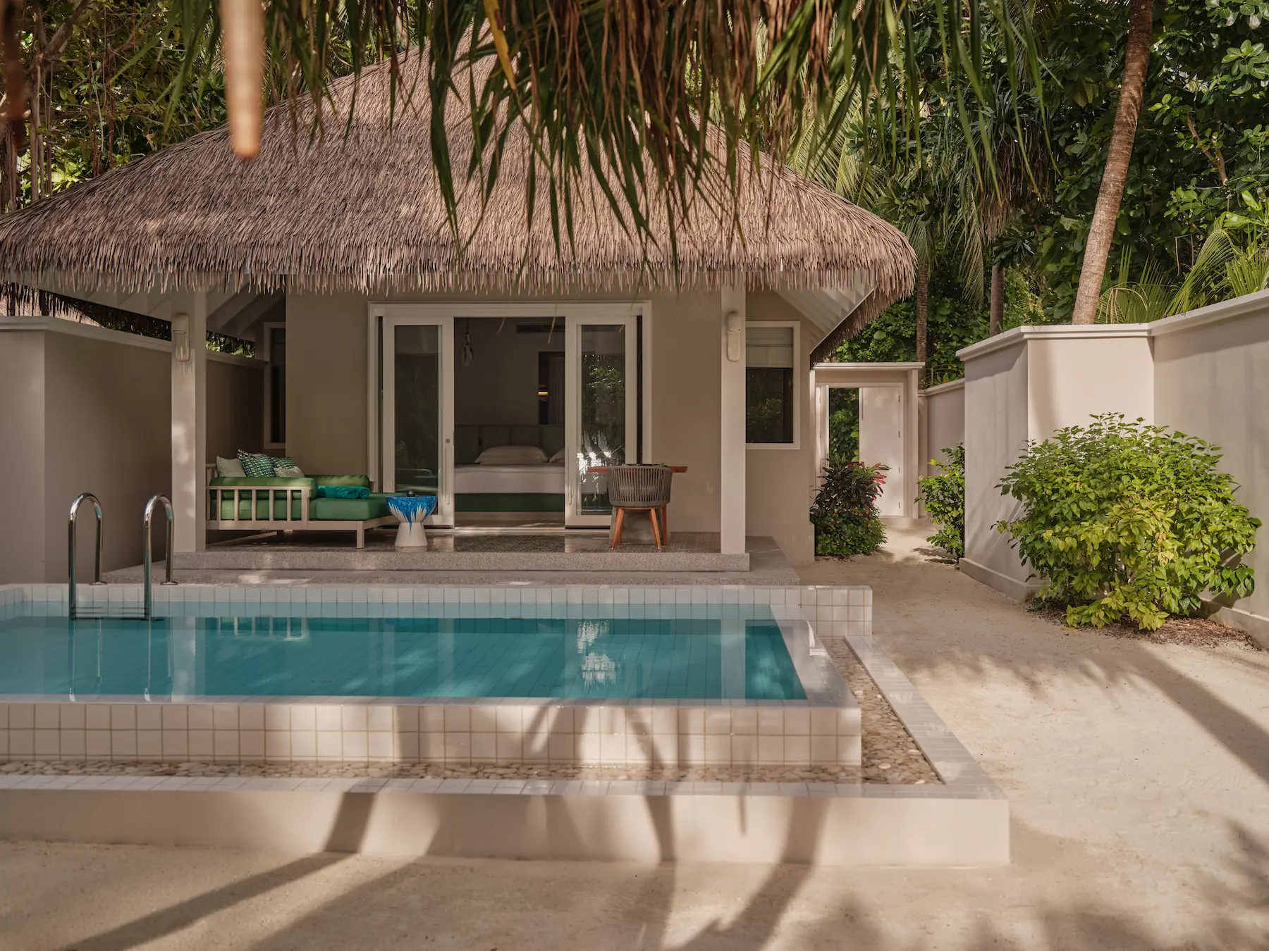 seaside finolhu private pool villa pool and terrace area featuring overwater lounging space private pool and serene maldives island ambience