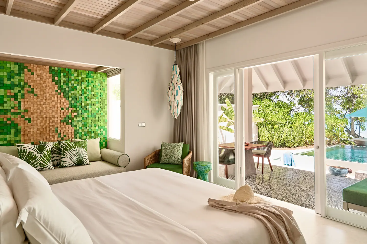 seaside finolhu two bedroom interconnecting beach villa featuring elegant coastal design spacious family layout and serene maldives island ambience