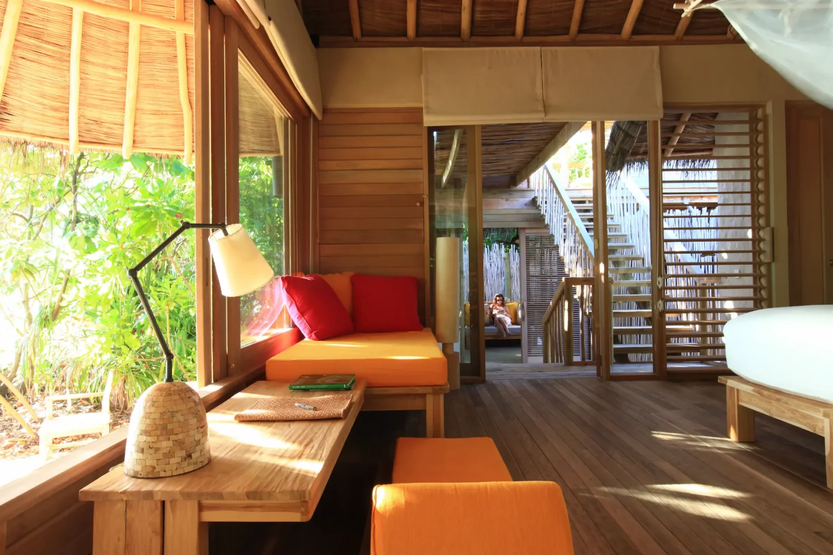 six senses laamu maldives family lagoon beach villa with pool interior featuring natural textures soft warm lighting and a calm elevated barefoot luxury atmosphere