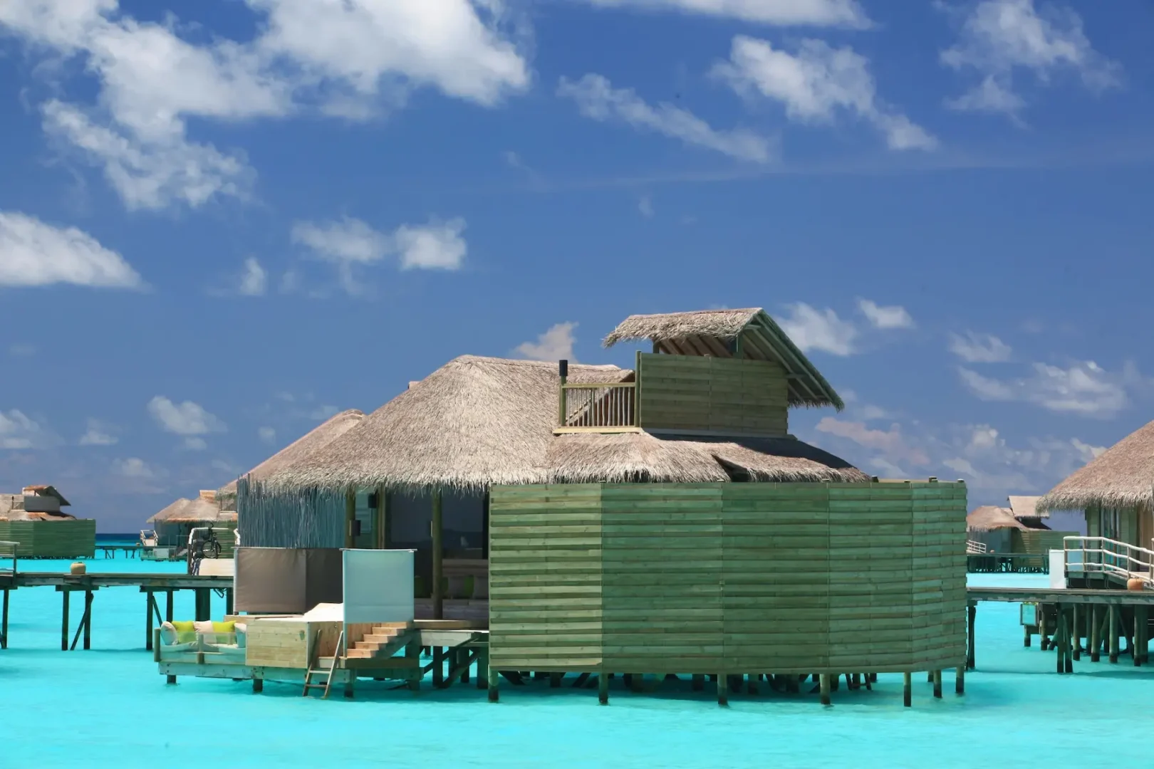 six senses laamu maldives laamu water villa exterior with panoramic lagoon views natural wood architecture and a calm elevated barefoot luxury ambience