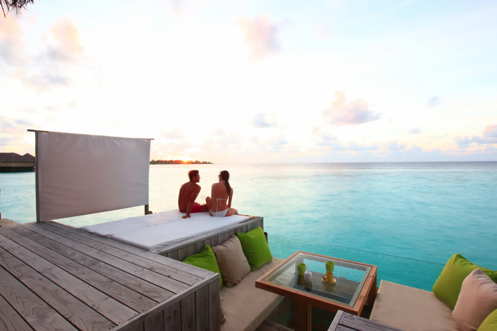 six senses laamu maldives laamu water villa with pool deck overlooking the lagoon featuring natural wood design and a serene elevated barefoot luxury atmosphere