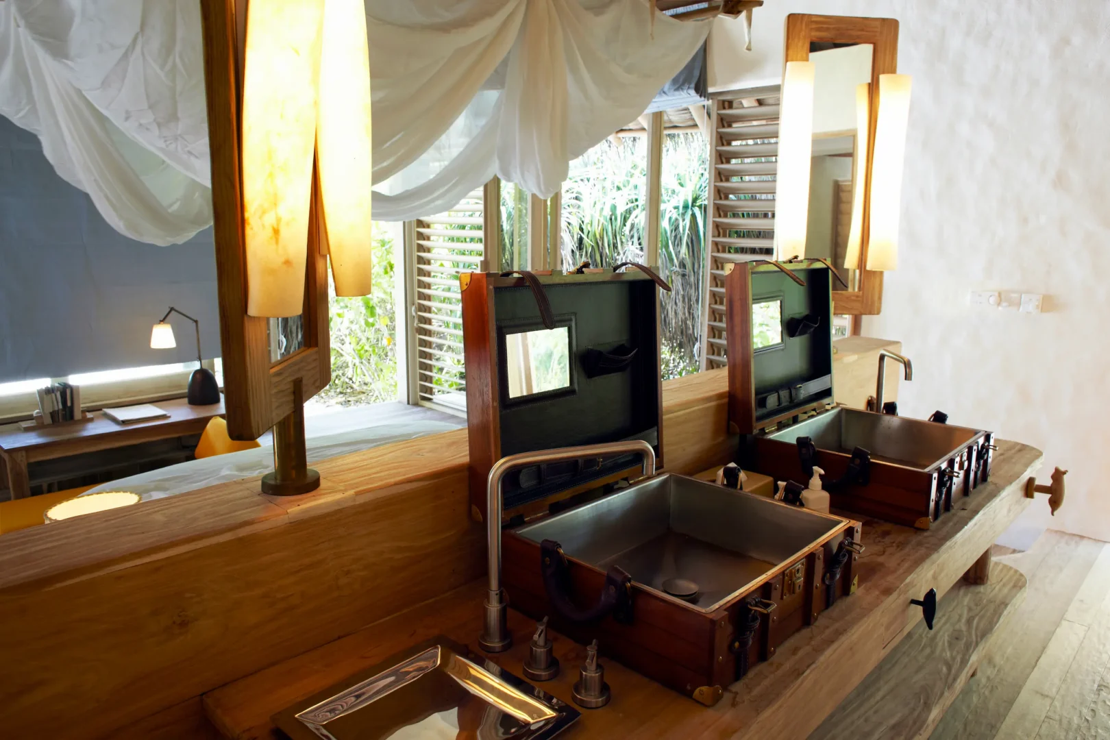 six senses laamu maldives lagoon beach villa with pool bathroom interior featuring natural textures warm ambient light and a calm refined barefoot luxury atmosphere