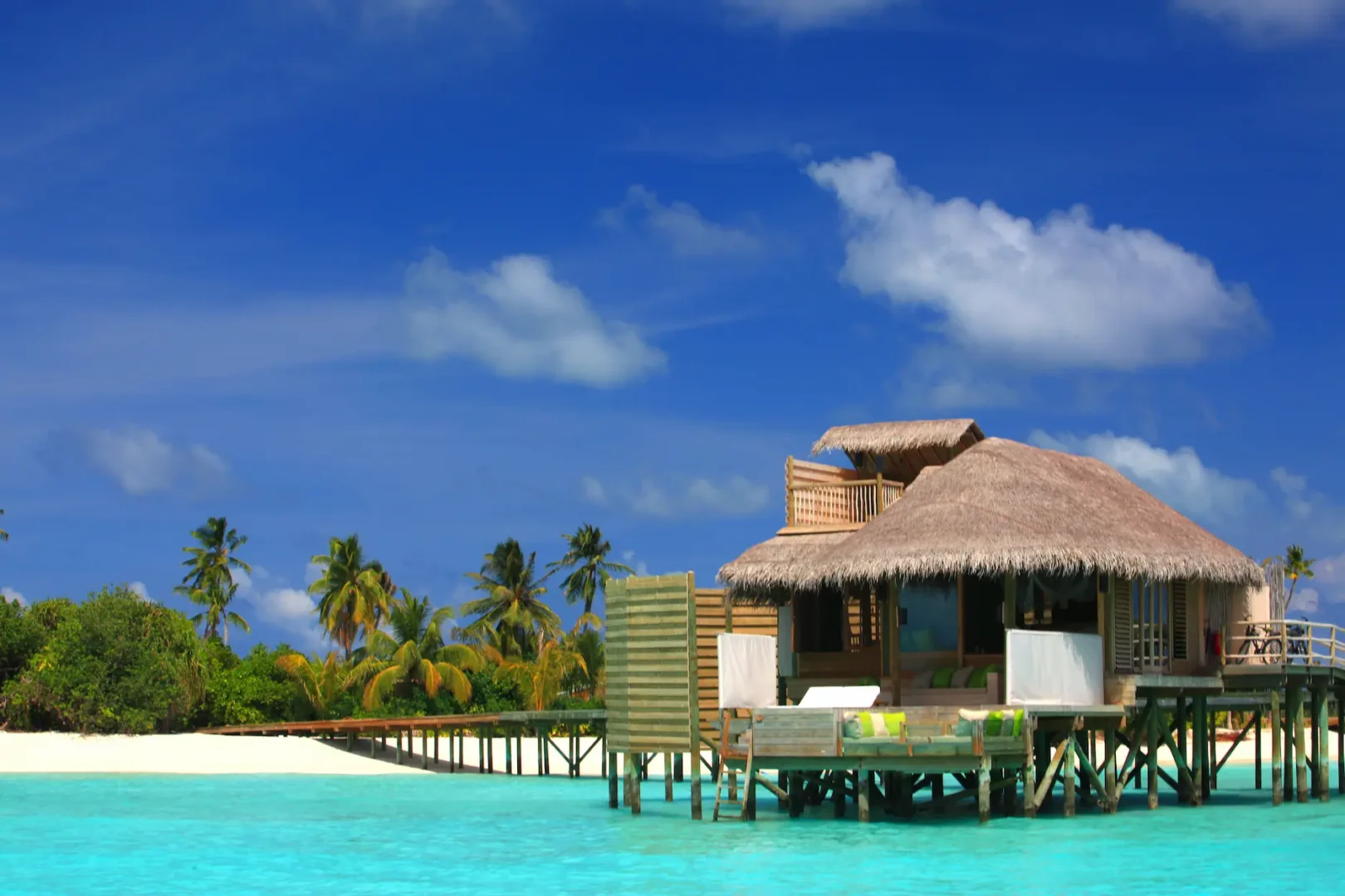 six senses laamu maldives lagoon water villa with calm turquoise lagoon views and refined barefoot luxury interiors