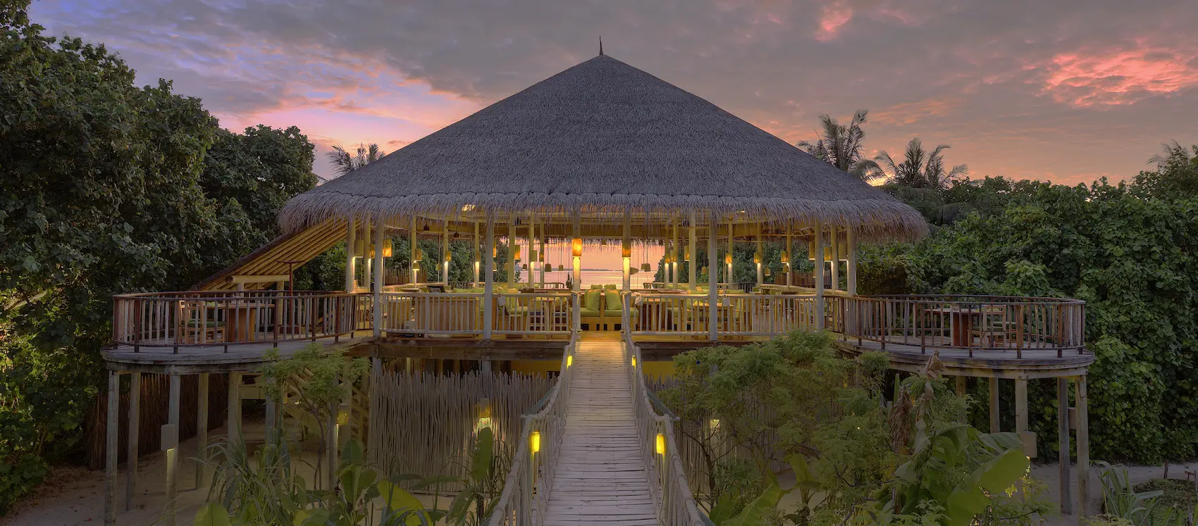 six senses laamu maldives leaf restaurant elevated among organic gardens with natural wood styling and a serene refined barefoot luxury dining atmosphere