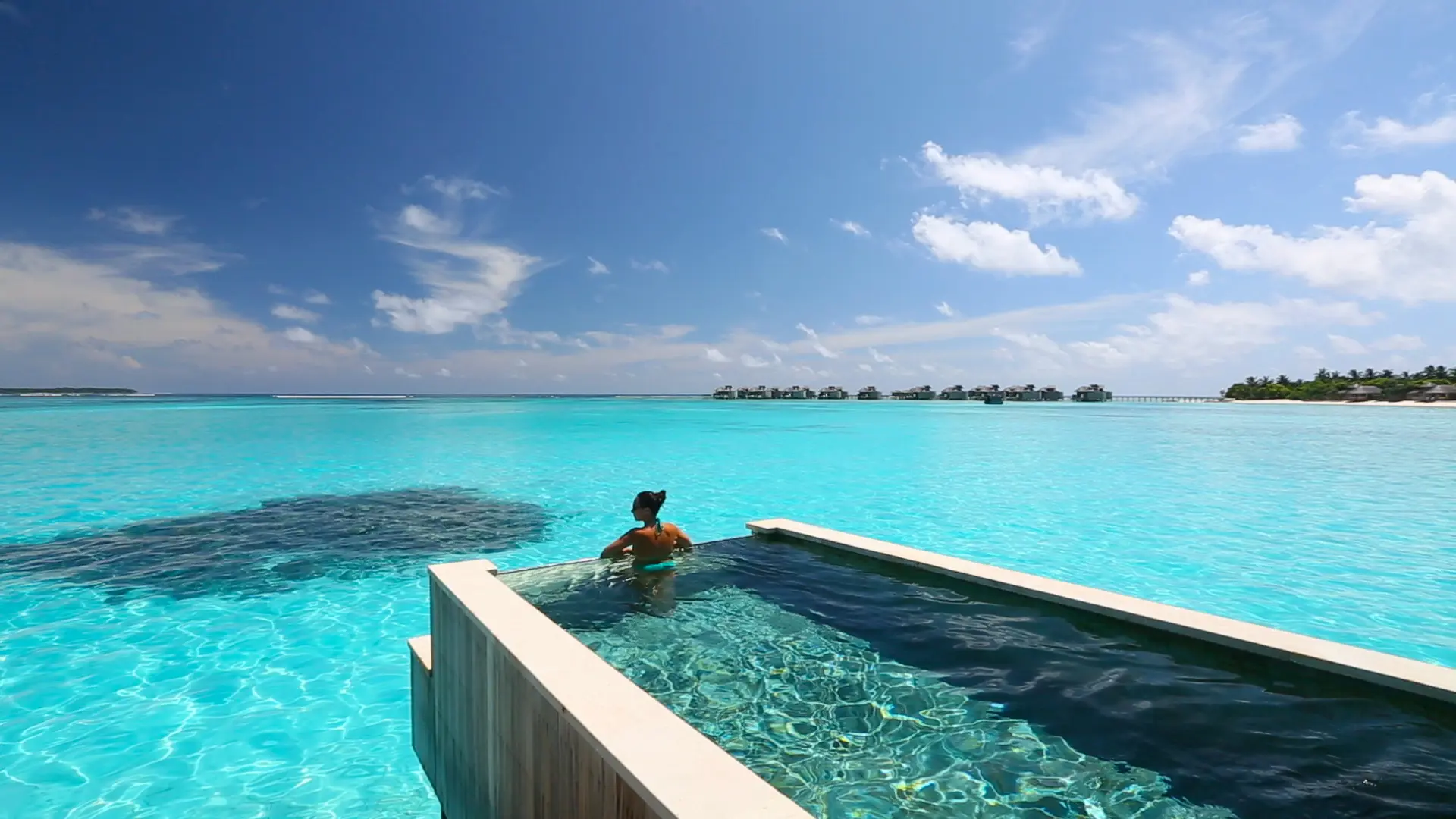 six senses laamu maldives ocean water villa with pool overlooking the lagoon featuring natural wood design and a serene elevated barefoot luxury atmosphere