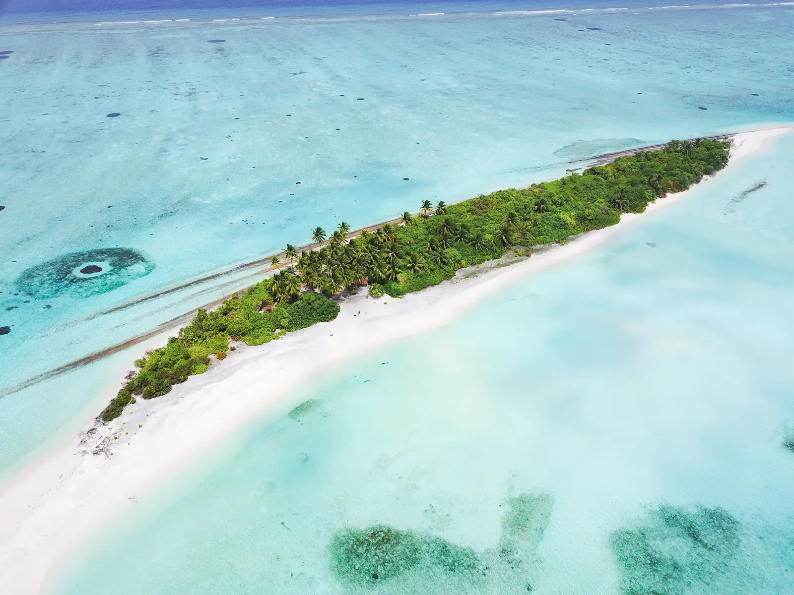 six senses laamu maldives private island experience with pristine white sand turquoise waters and a serene elevated barefoot luxury atmosphere