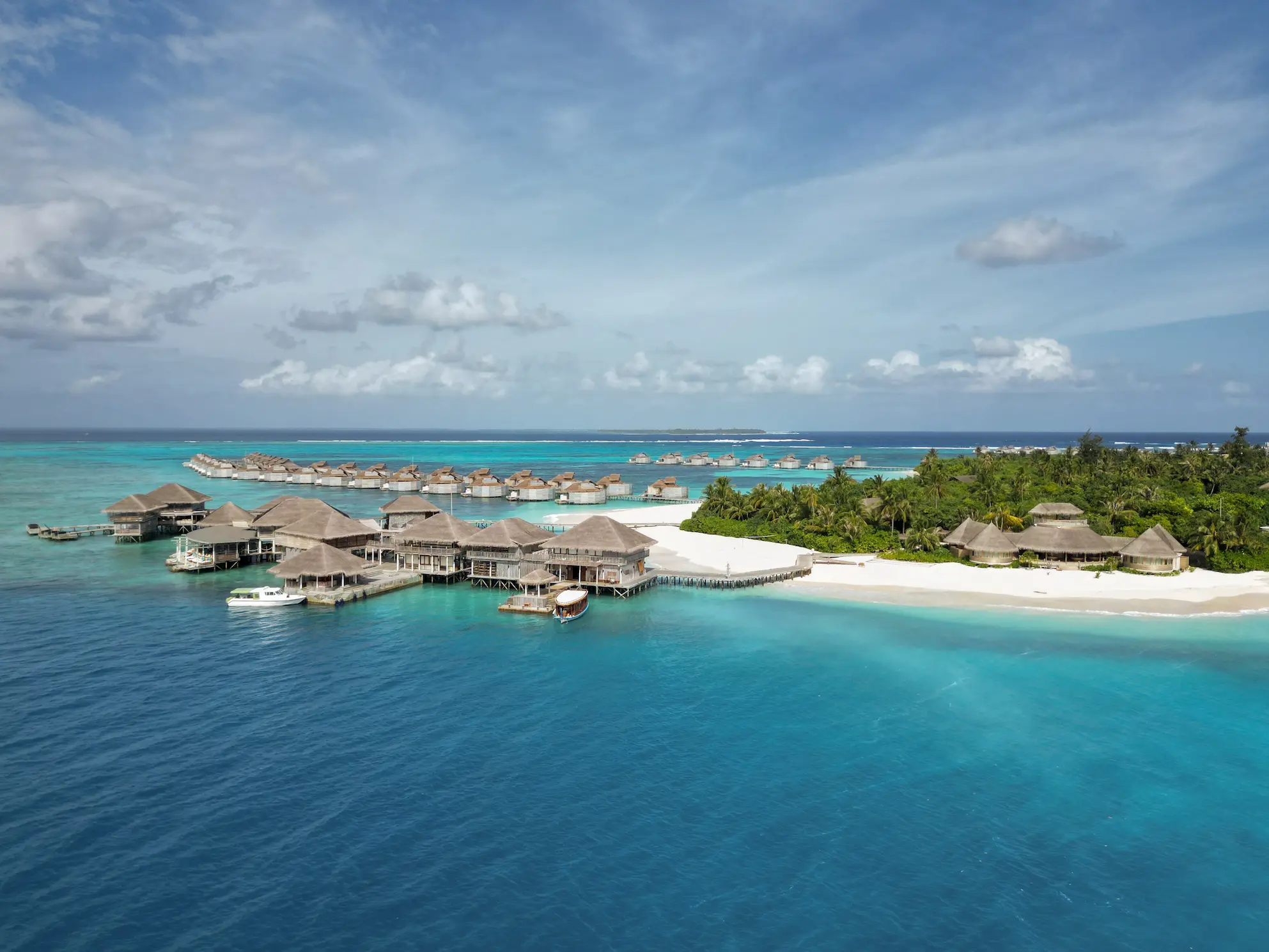 six senses laamu maldives the overwater and shell set above the lagoon with natural textures gentle light and a serene elevated barefoot luxury wellness atmosphere