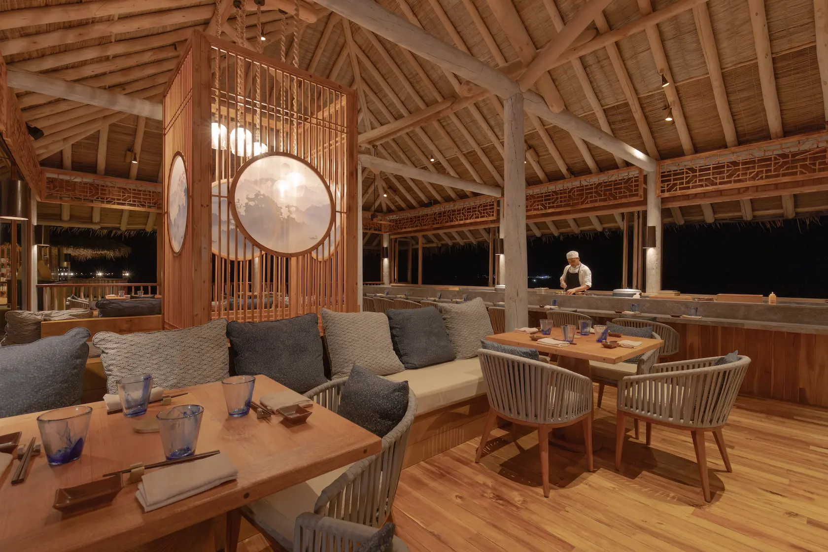 six senses laamu maldives zen restaurant with tranquil ocean views natural wood design and a serene elevated barefoot luxury dining atmosphere