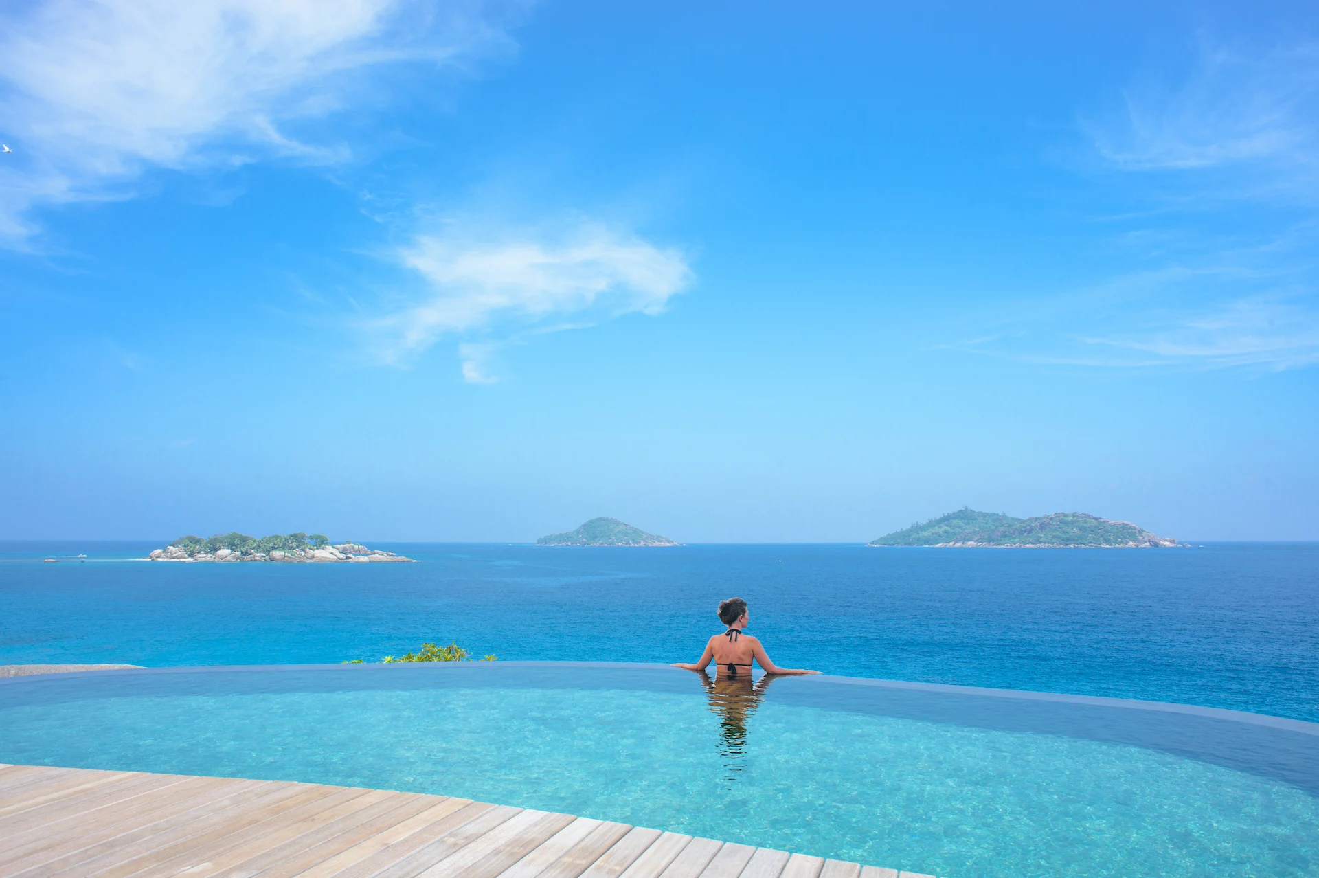 spa pool at six senses seychelles with ocean view and natural landscape around
