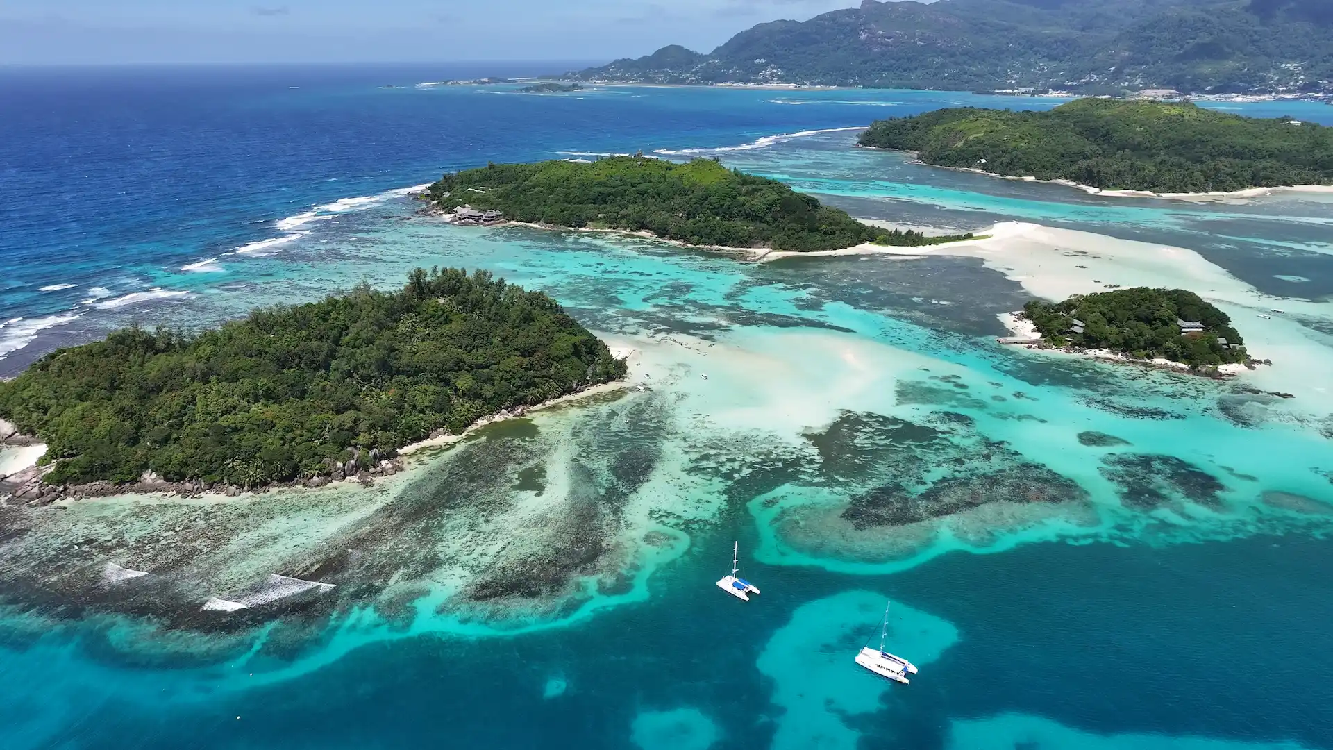 st anne seychelles islands with lush tropical hills surrounded by clear turquoise ocean and white sandy beaches