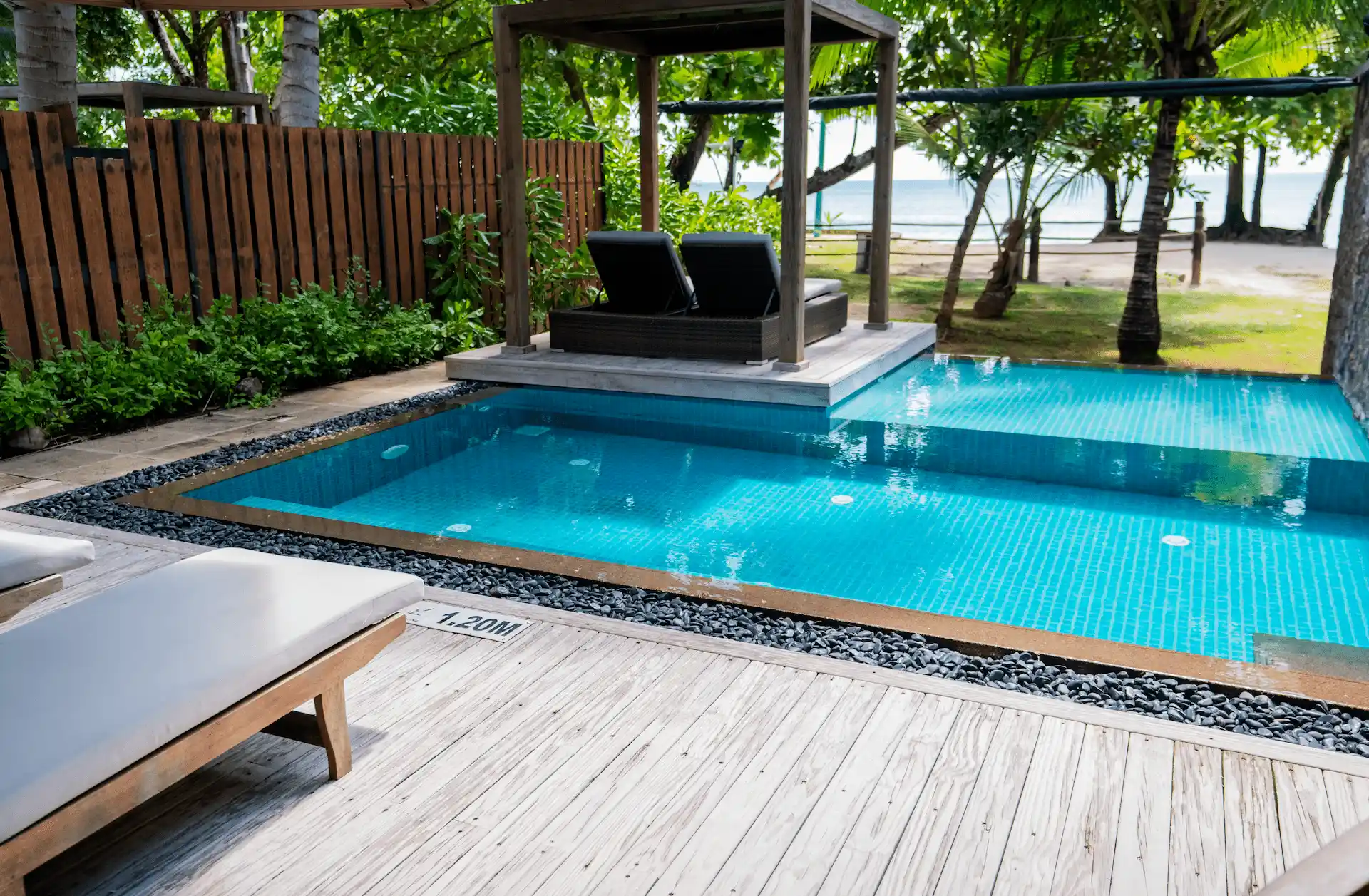 Private pool of a beach pool villa in Seychelles with direct access to the sandy beach and turquoise waters