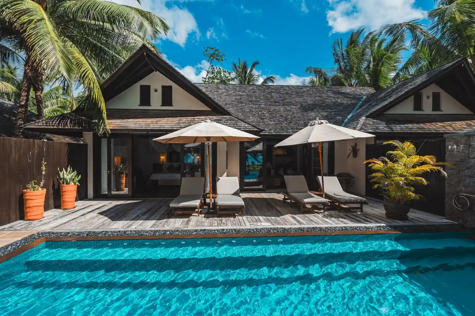 Grand beach pool villa in Seychelles with a private pool overlooking the sandy beach and turquoise ocean views