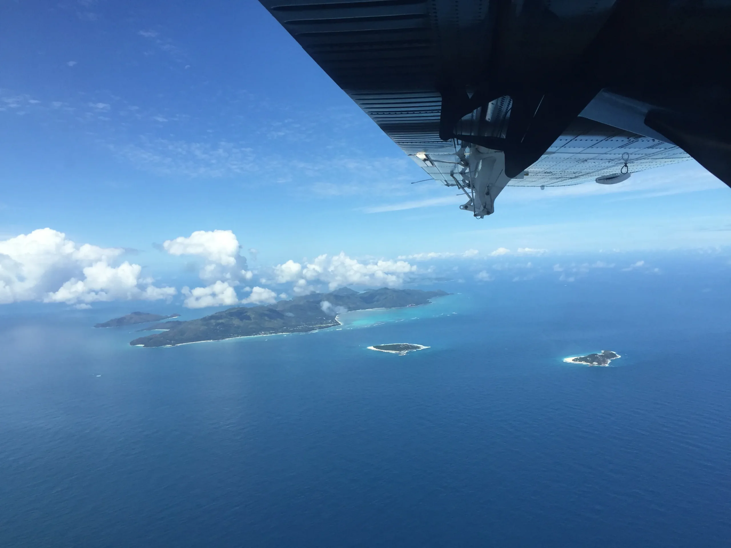 sun siyam maldives seaplane flying above island