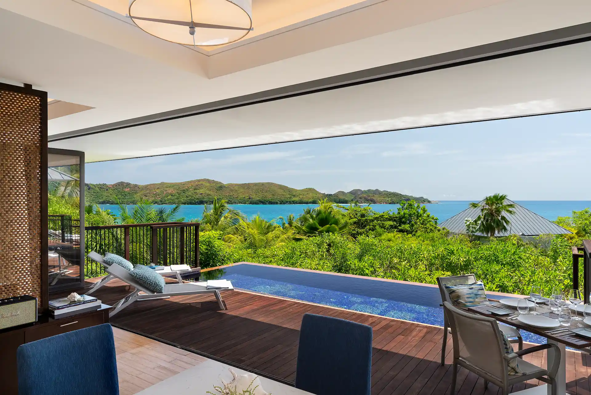 private pool view of two bedroom ocean pool villa in seychelles with turquoise sea and tropical surroundings