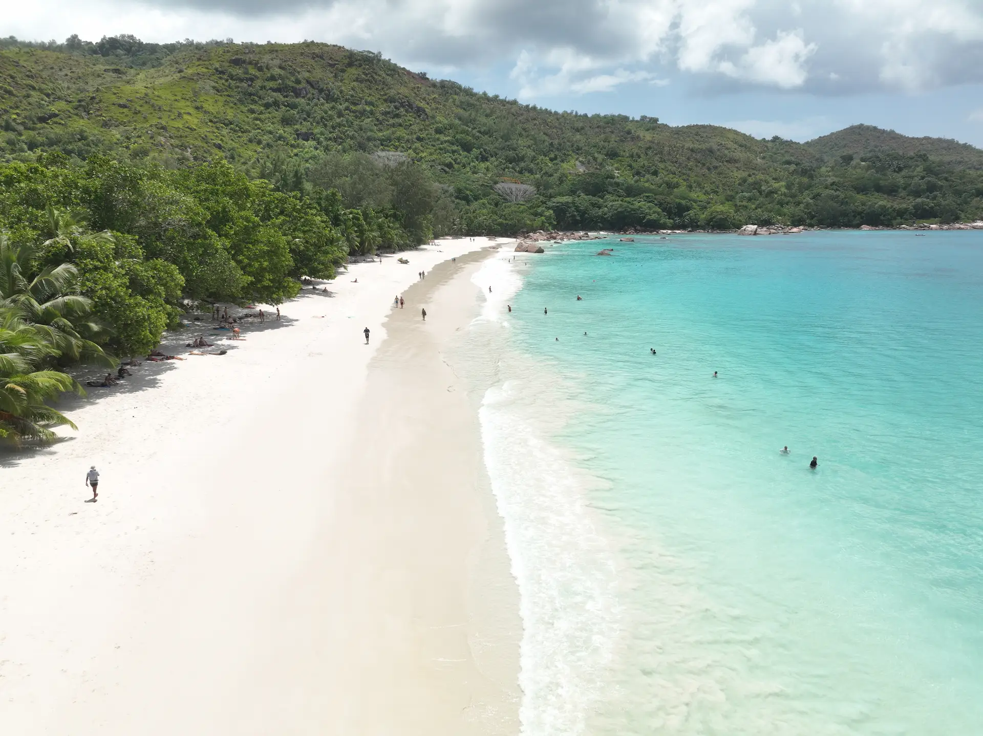 beach and sea during a cruise with Variety Cruises in the Seychelles showing white sand meeting calm turquoise waters with tropical surroundings
