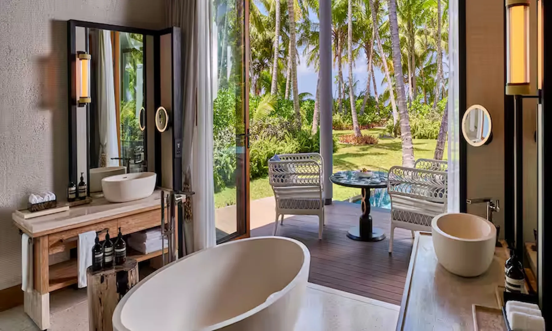 waldorf astoria seychelles one bedroom hawksbill garden pool villa bathroom with pool and garden view
