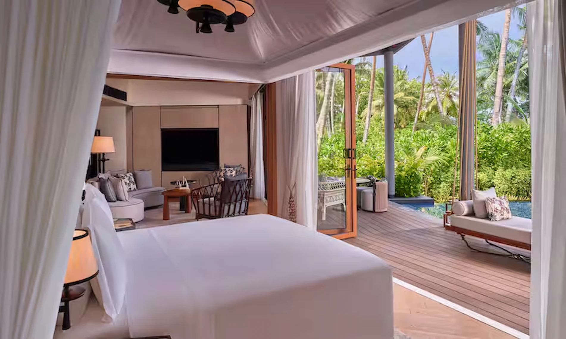 waldorf astoria seychelles one bedroom hawksbill garden pool villa bed with view of pool and garden