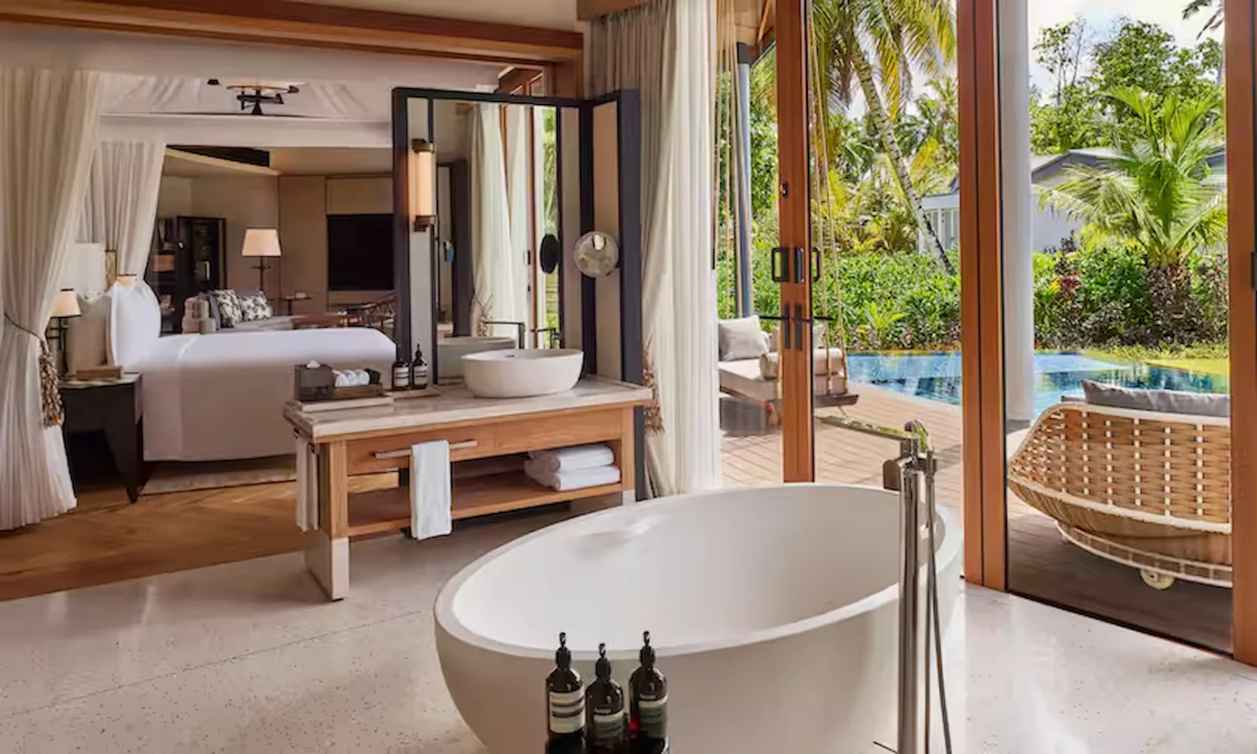 waldorf astoria seychelles one bedroom hawksbill pool villa bathroom with modern fixtures and pool view