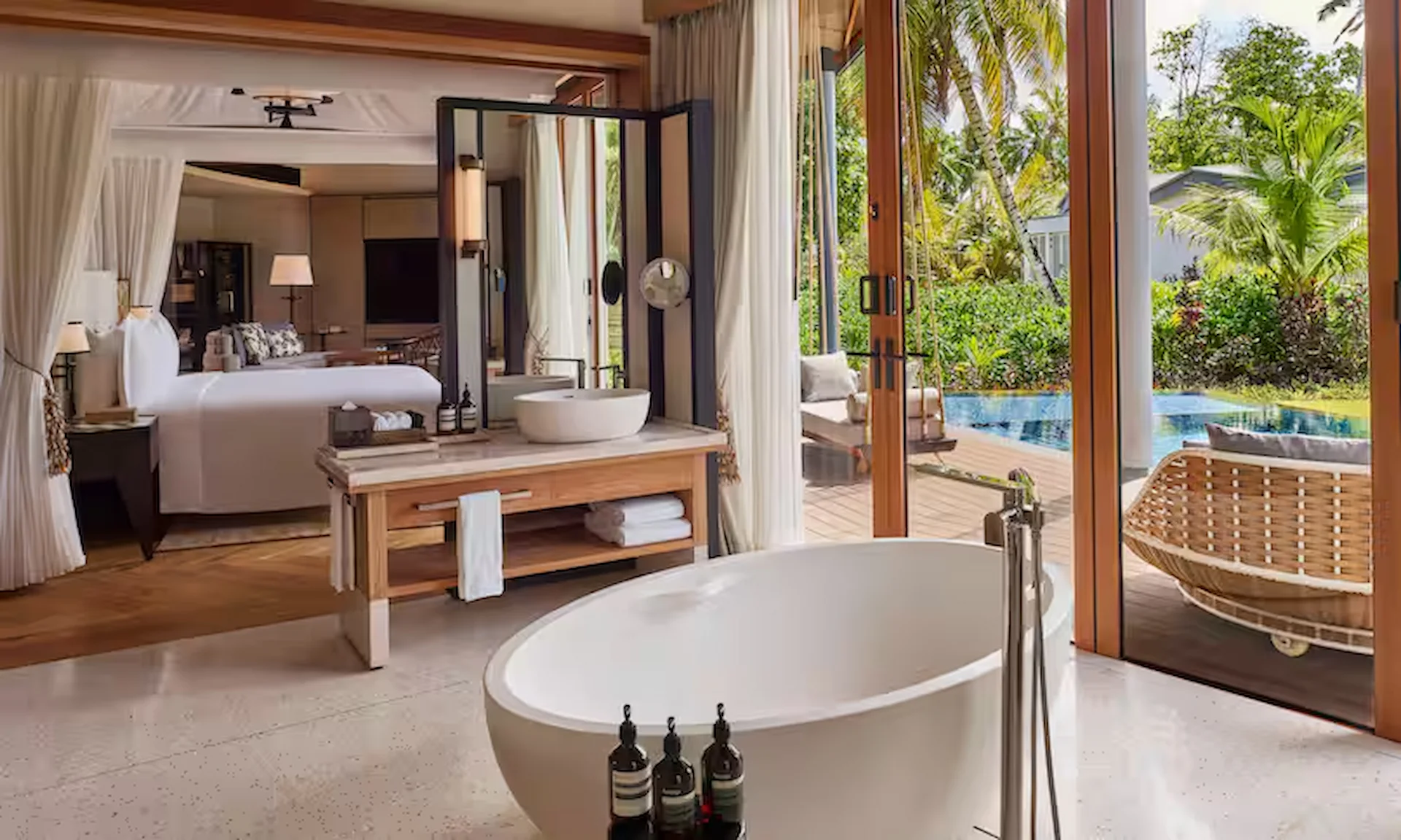 waldorf astoria seychelles one bedroom hawksbill pool villa bathroom with modern fixtures and pool view