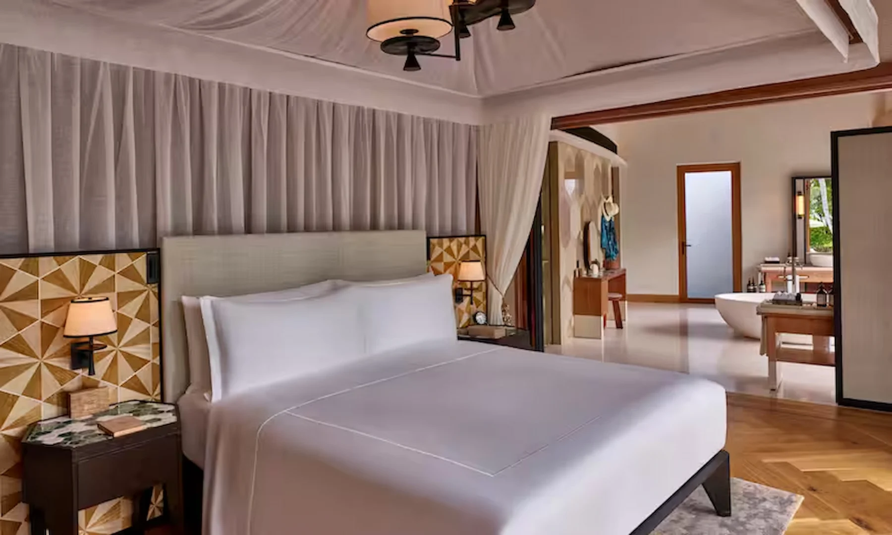 waldorf astoria seychelles one bedroom hawksbill pool villa bed with view of private pool and outdoor area