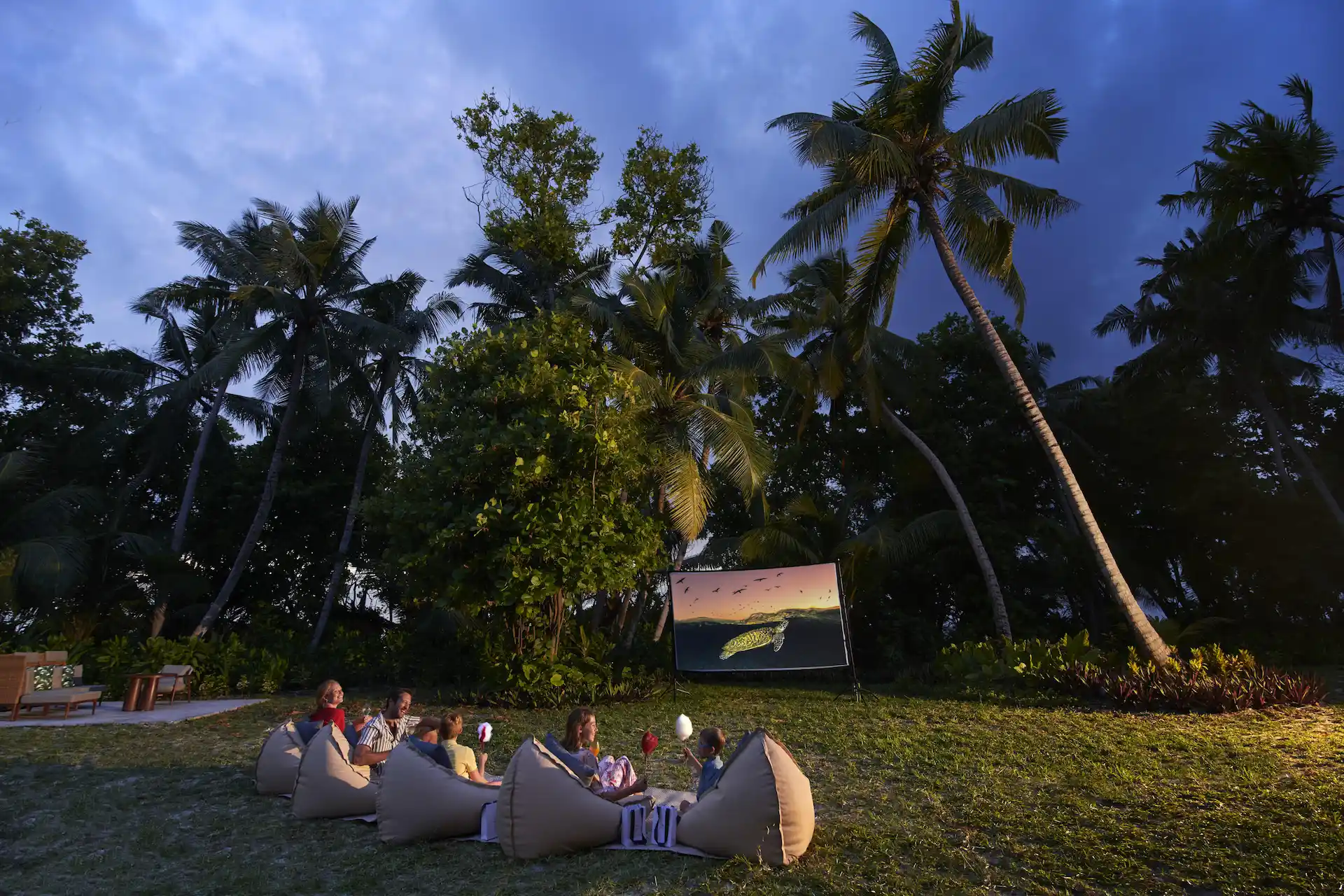 waldorf astoria seychelles platte island outdoor cinema with screen and seating under stars