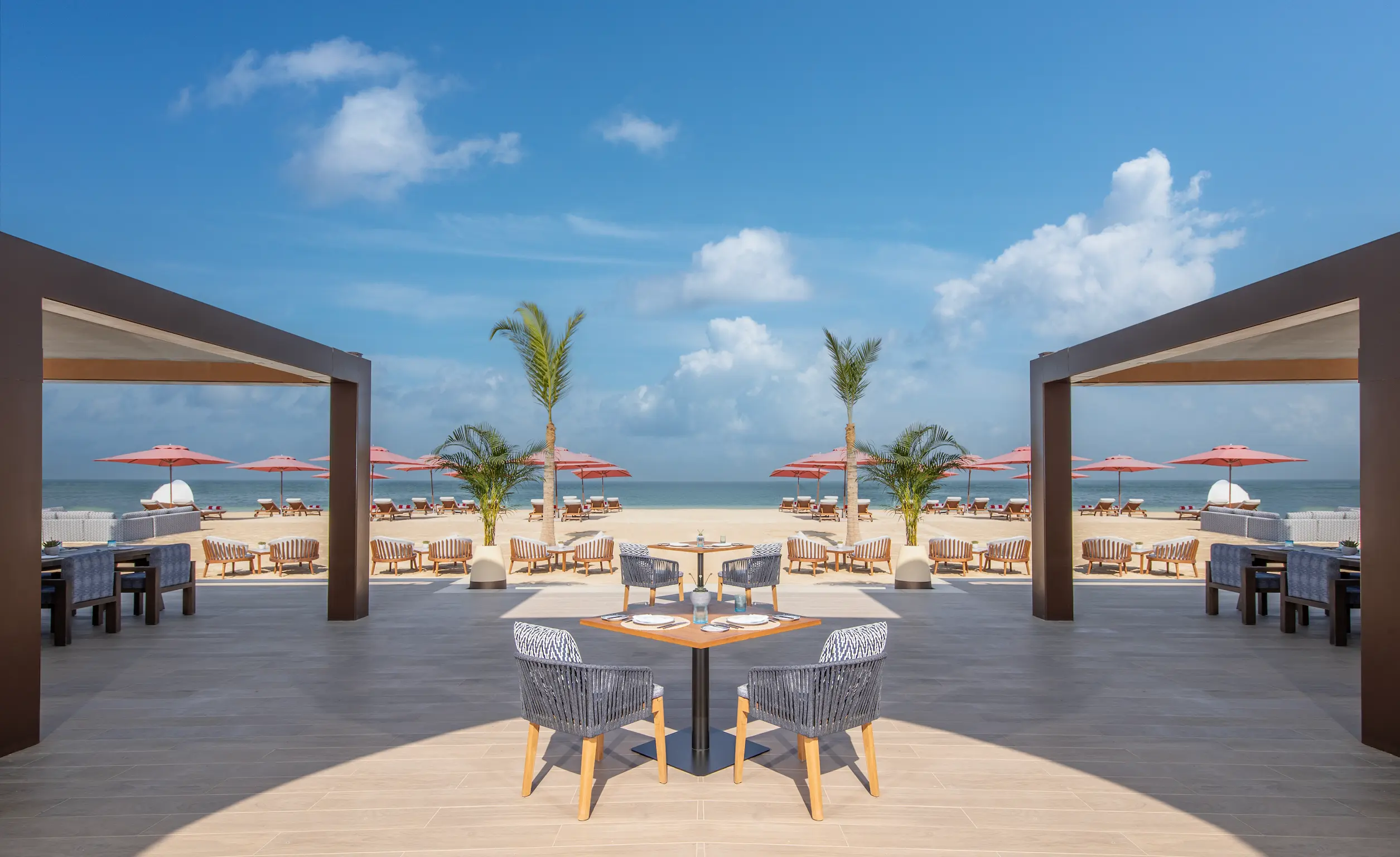 anantara mina ras al khaimah beach house outdoor showcasing a relaxed open air beachfront dining setting with coastal views