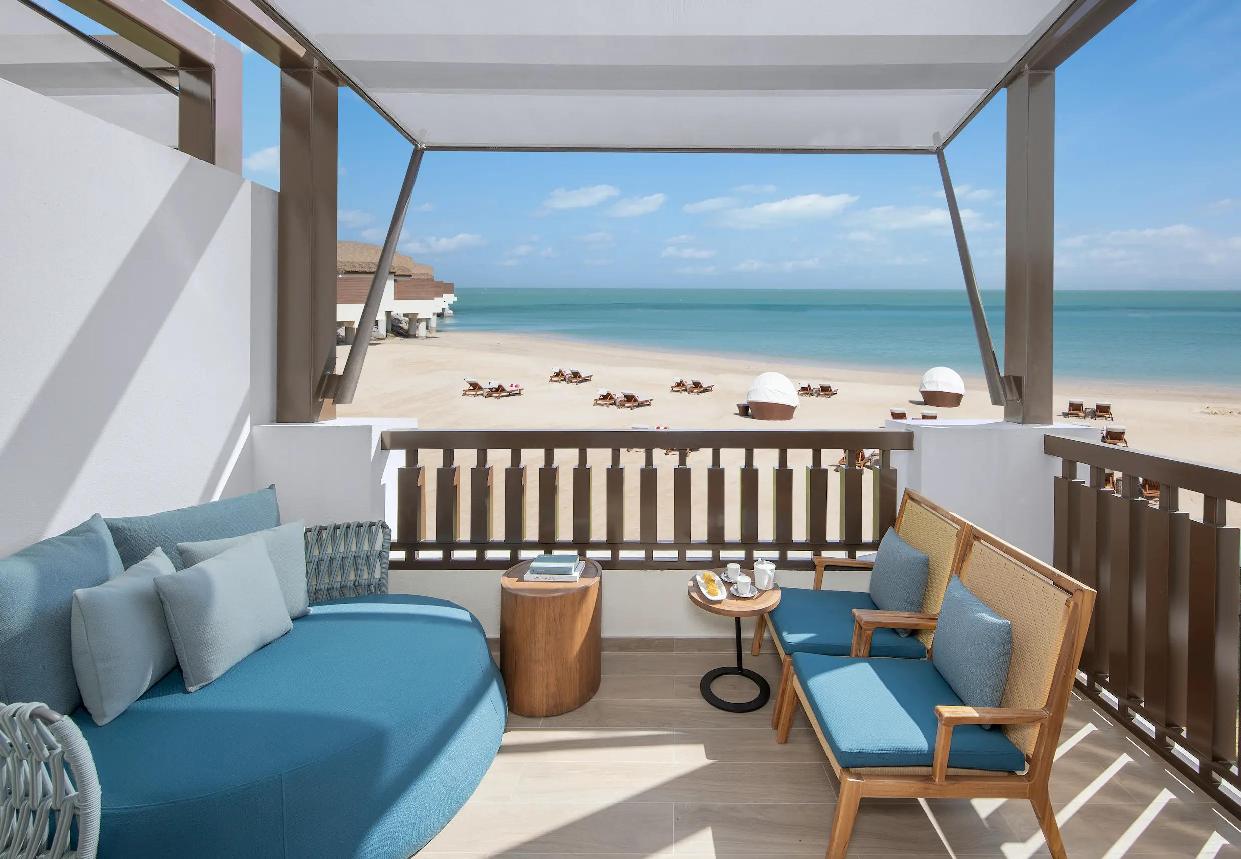 anantara mina ras al khaimah deluxe beach front room balcony featuring a private outdoor balcony overlooking the beachfront surroundings