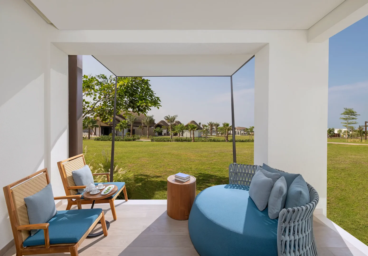 anantara mina ras al khaimah deluxe garden terrace room terrace lagoon view featuring a private outdoor terrace overlooking the tranquil lagoon