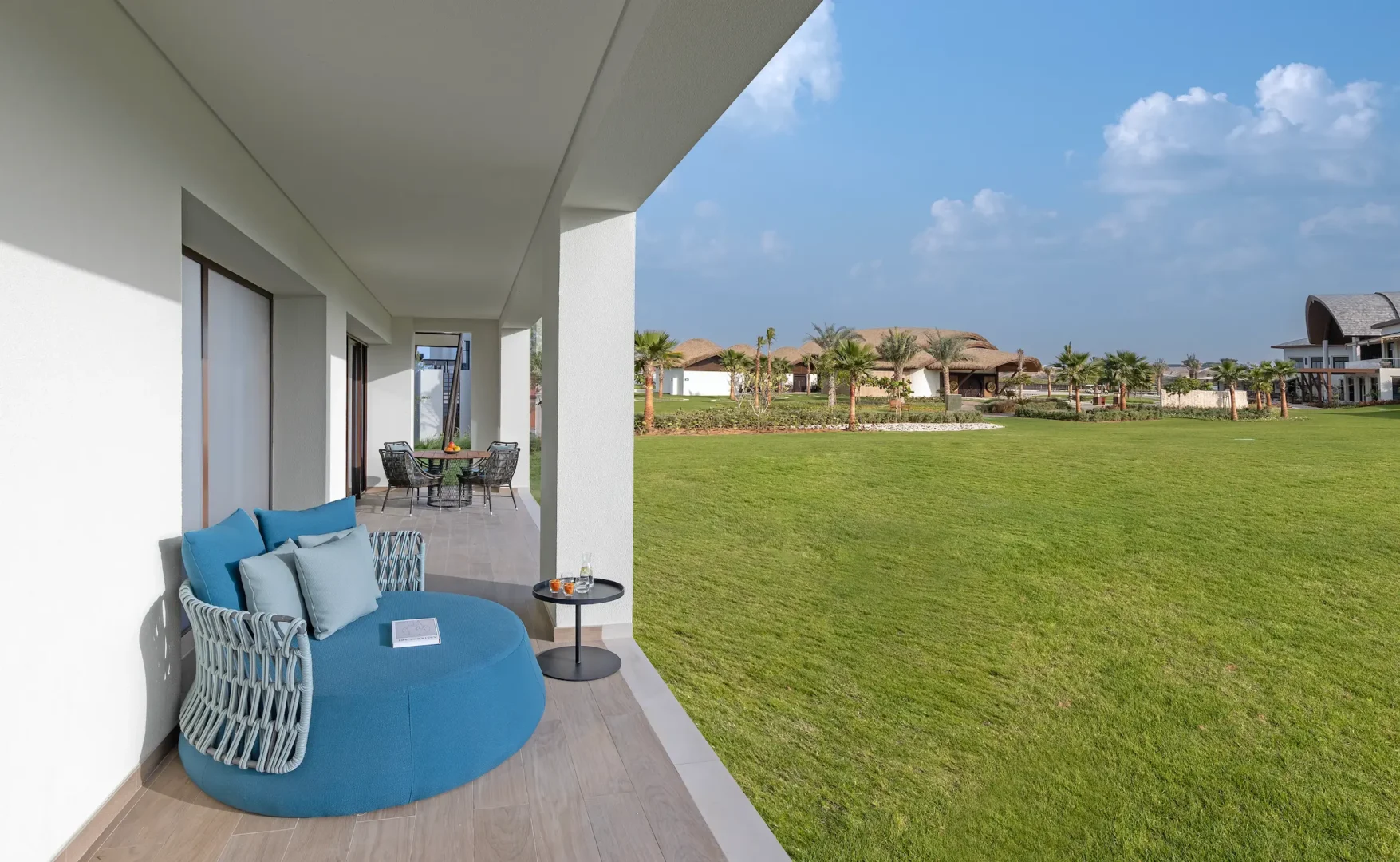 anantara mina ras al khaimah deluxe garden terrace suite garden view showcasing serene landscaped surroundings enjoyed from the private terrace