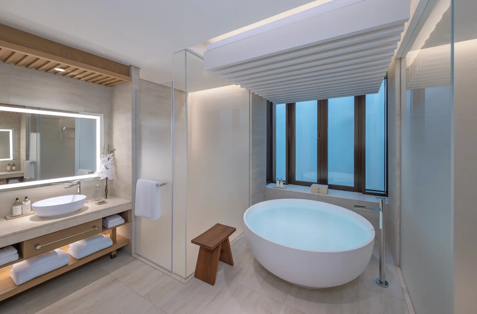 anantara mina ras al khaimah deluxe beach front room bathroom featuring a refined bathroom space with elegant finishes inspired by the coastal setting