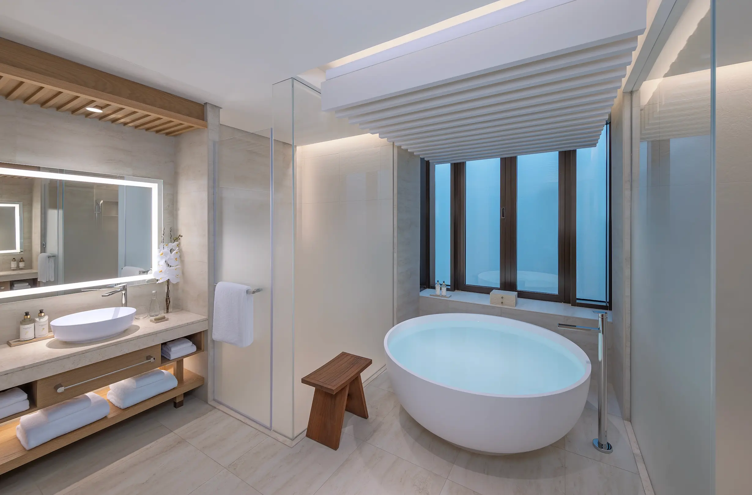 anantara mina ras al khaimah deluxe beach front room bathroom featuring a refined bathroom space with elegant finishes inspired by the coastal setting