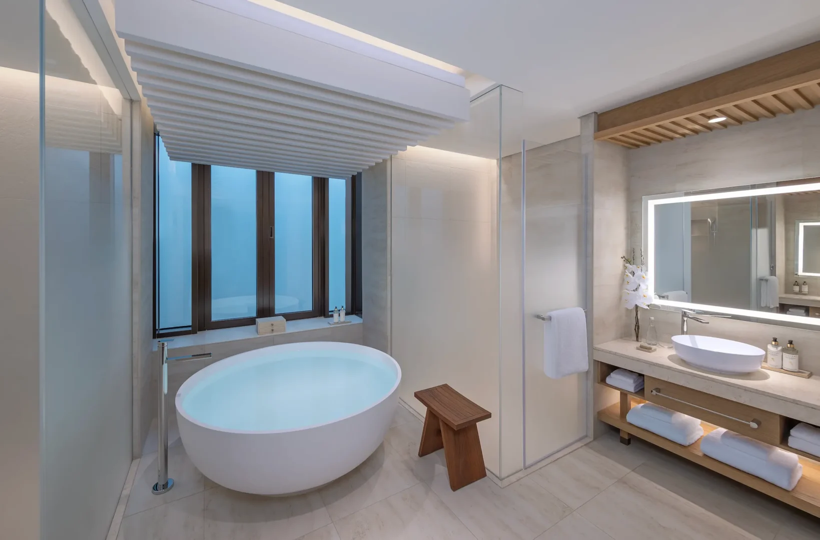 anantara mina ras al khaimah deluxe room bathroom featuring a refined bathroom space with elegant finishes and contemporary design