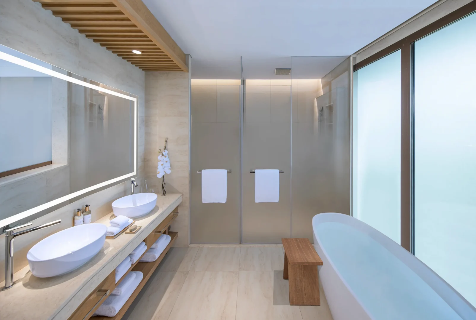 anantara mina ras al khaimah deluxe suite bathroom featuring a refined bathroom space with elegant finishes and contemporary design