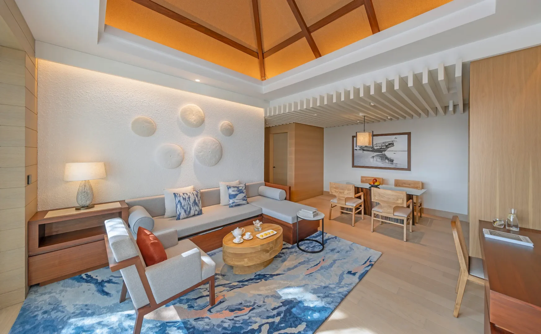 anantara mina ras al khaimah deluxe suite living room featuring a spacious and refined living area designed for relaxed coastal living