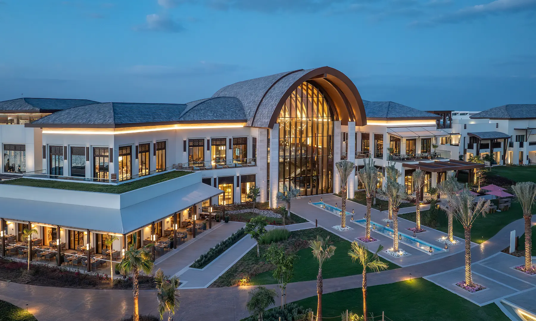 anantara mina ras al khaimah exterior view side showcasing a lateral perspective of the resort architecture set within its coastal surroundings