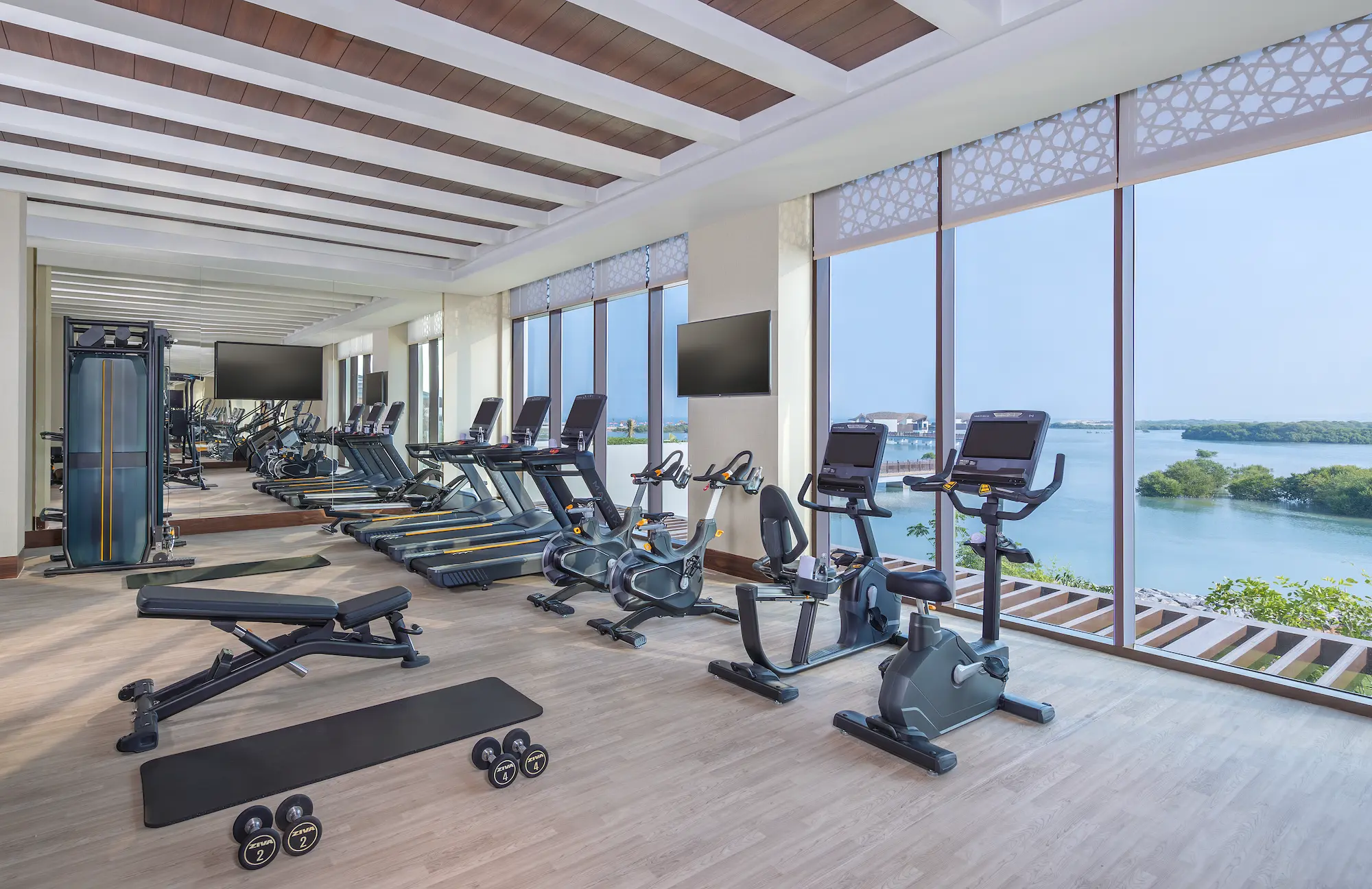 anantara mina ras al khaimah gym showcasing a modern fitness facility equipped for strength training and personal wellness