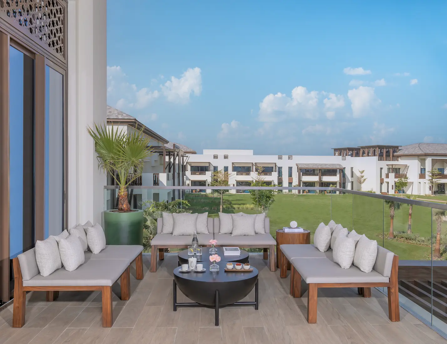 anantara mina ras al khaimah lobby lounge terrace showcasing an elegant outdoor terrace designed for relaxed social moments overlooking the resort surroundings