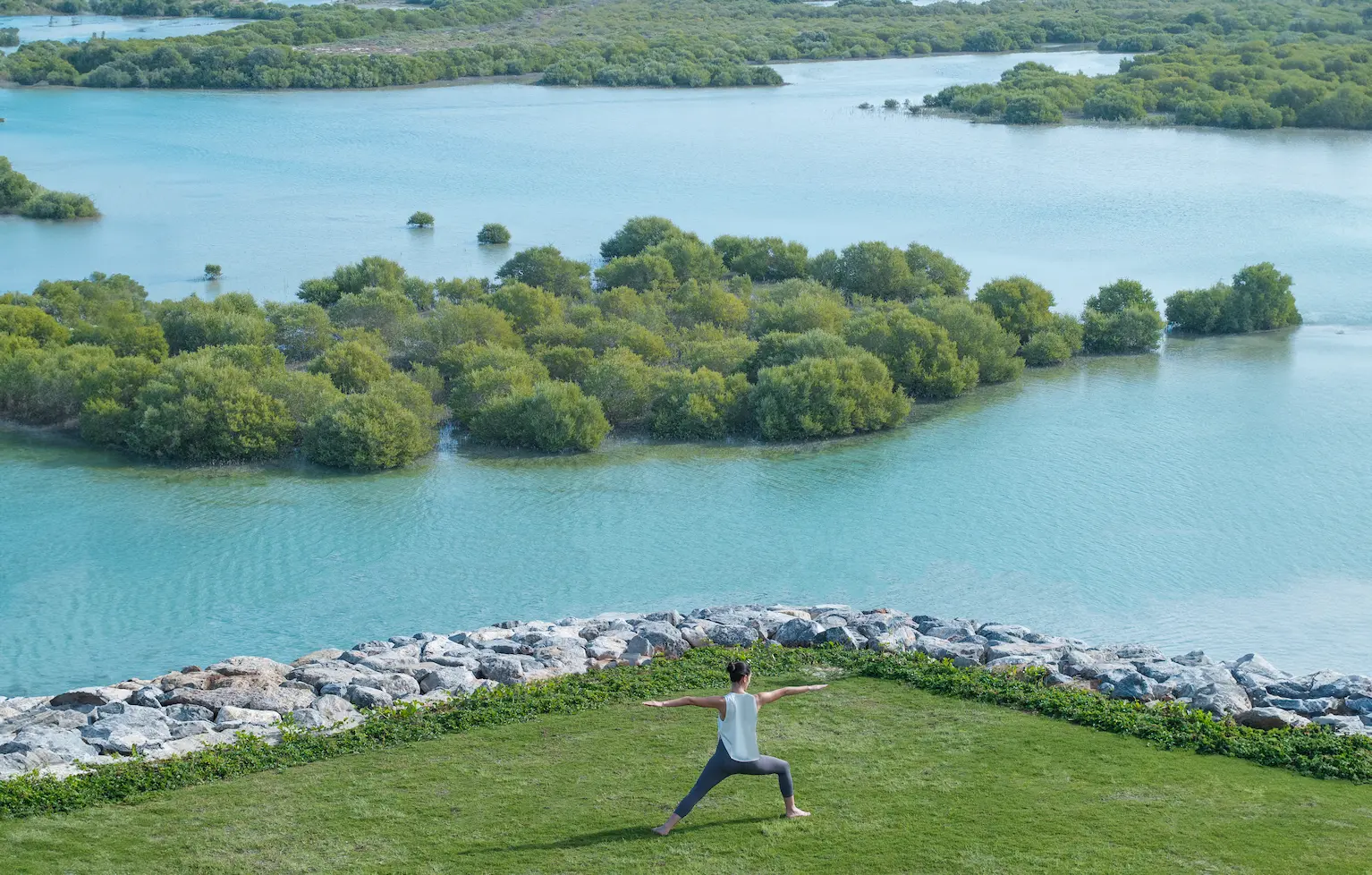 anantara mina ras al khaimah outdoor yoga offering a tranquil open air wellness session set within the serene resort surroundings