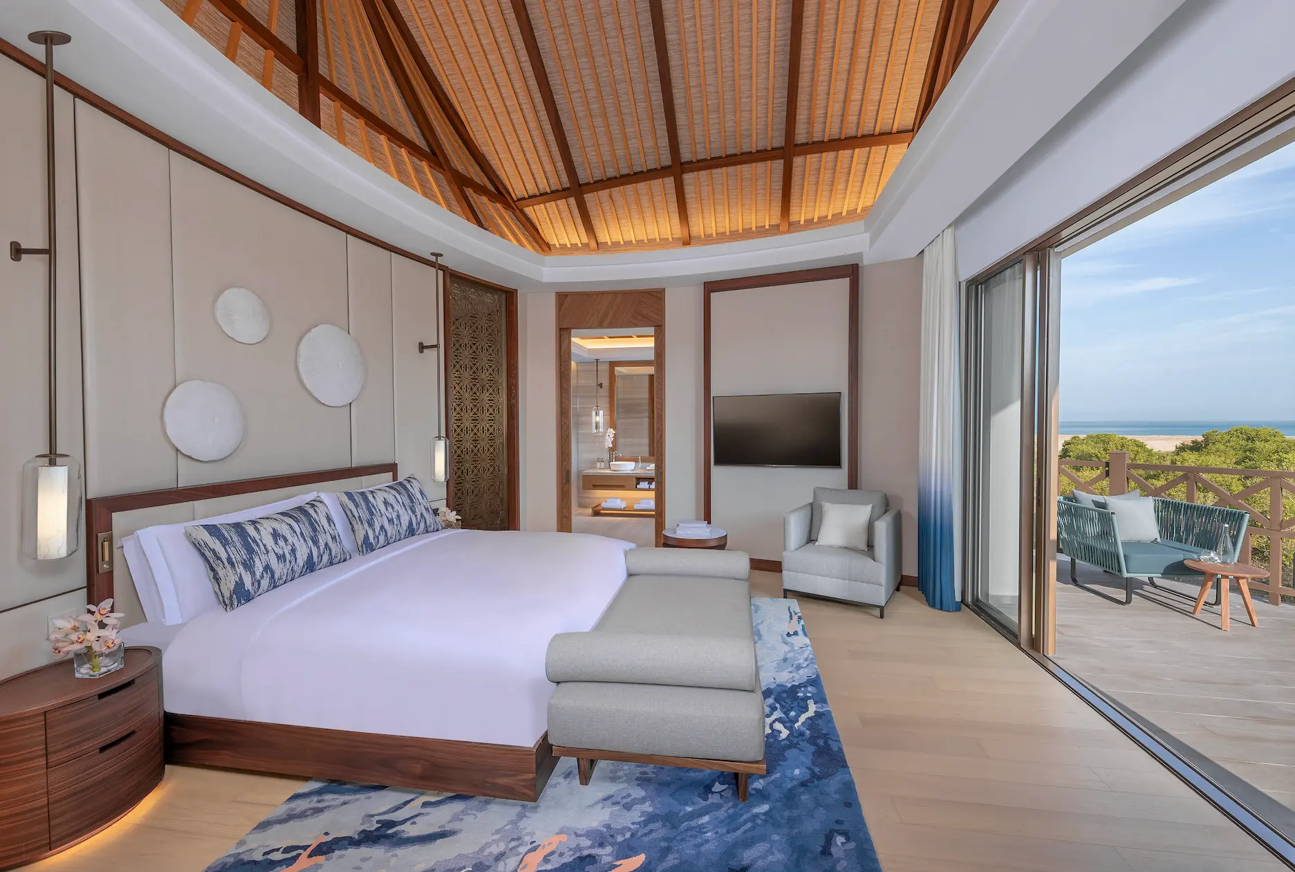 anantara mina ras al khaimah over water pool villa bedroom featuring an elegant villa bedroom surrounded by tranquil lagoon views and refined coastal design