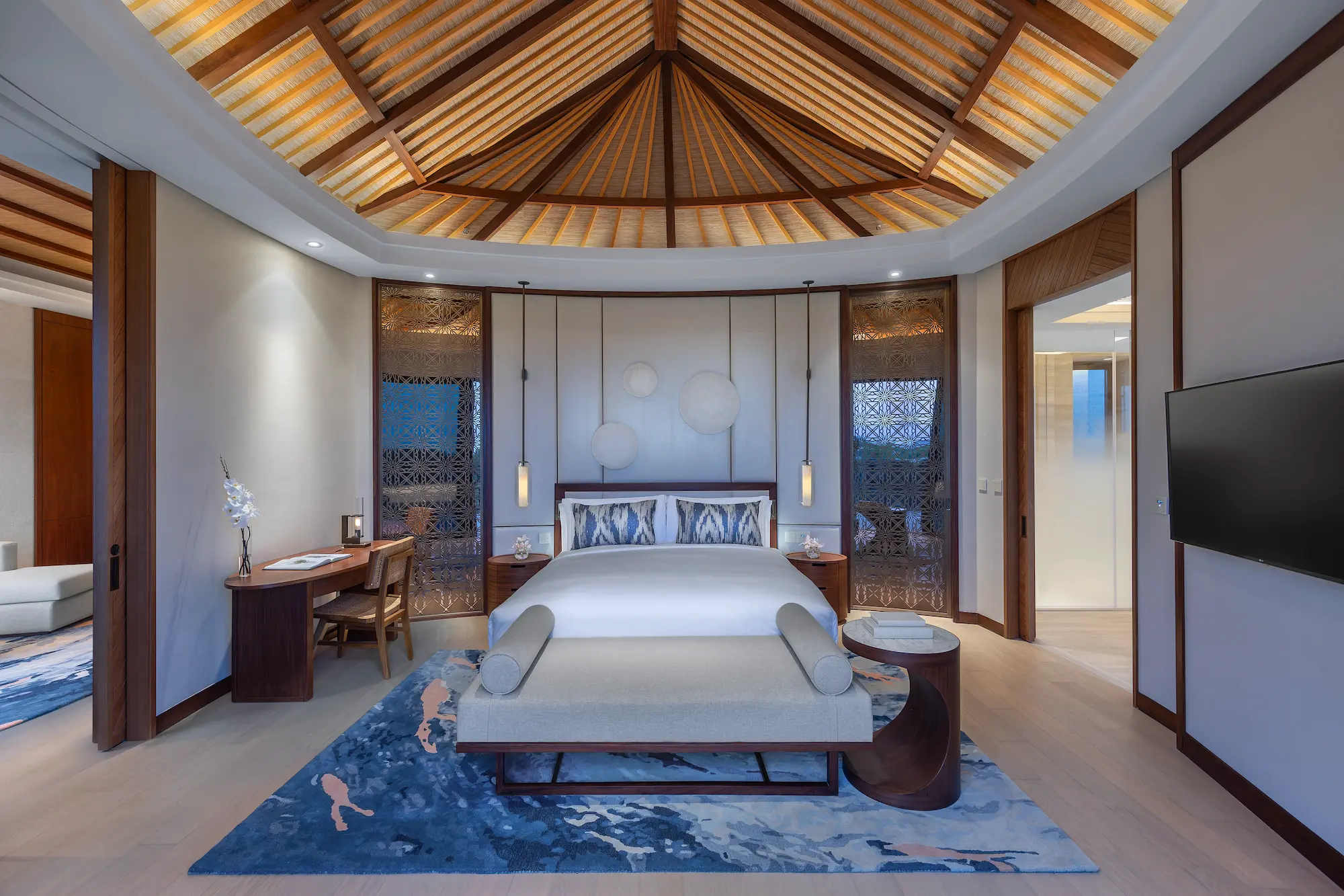 anantara mina ras al khaimah over water pool villa bedroom featuring an elegant bedroom with uninterrupted lagoon views and refined coastal design